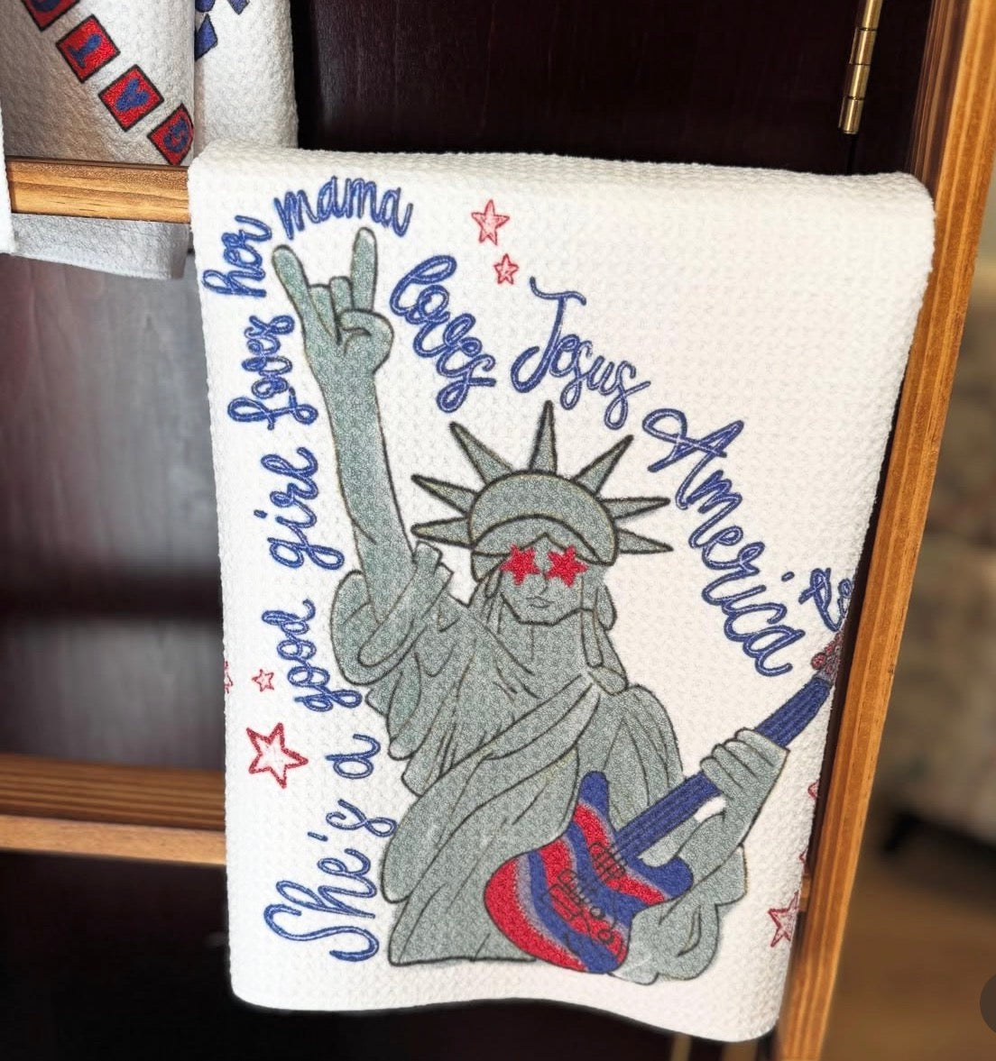Patriotic Lady Liberty embroidered hand towel with guitar and American script lettering