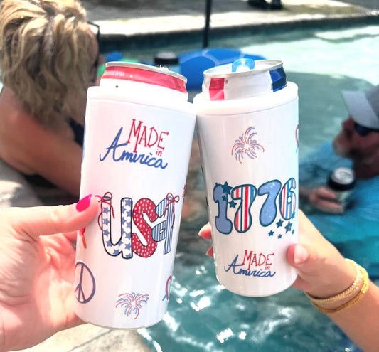 Patriotic skinny koozies with UV DTF USA and 1776 designs being cheersed poolside